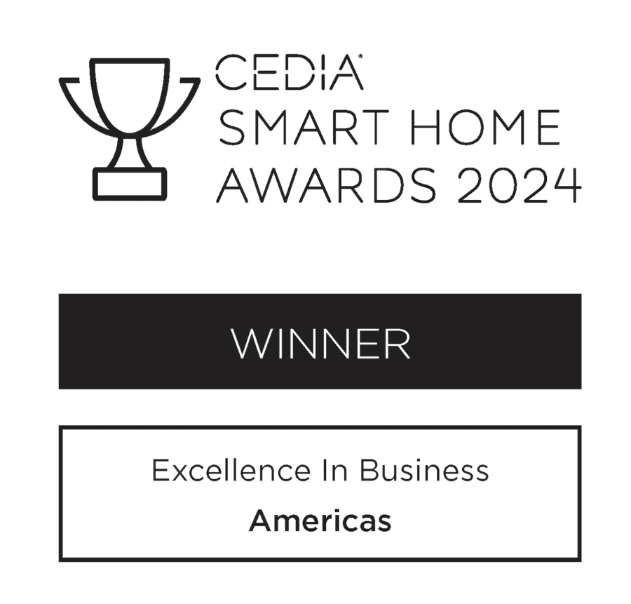 Logo showing a trophy icon with the text 'CEDIA Smart Home Awards 2024.' Below, it says 'WINNER' and 'Excellence in Business - Americas.'