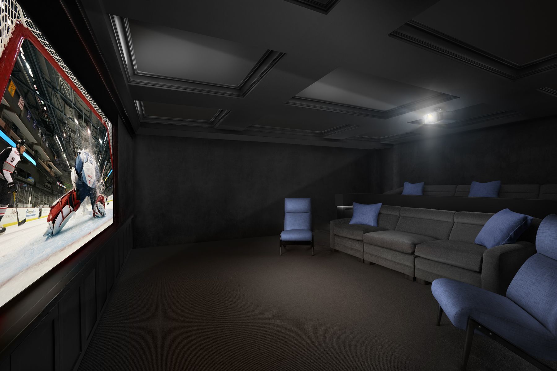 home theater with black walls and black furniture with blue pillows